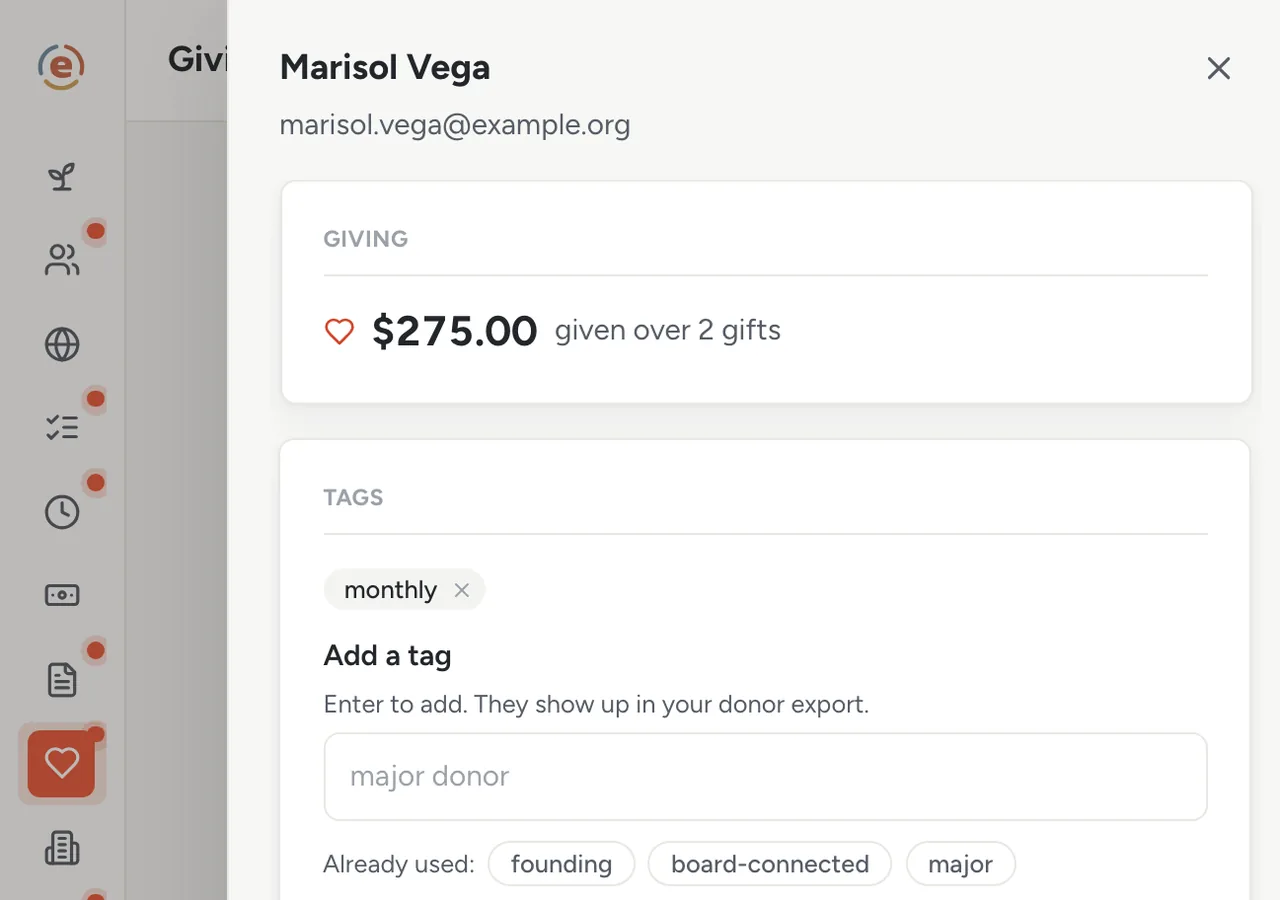 A donor profile in Ember Giving with lifetime total, tags, giving history and the Year-end statement button